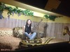 Girl in the aquarium with snake