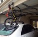 Bike on the roof jammed at the entrance to the garage